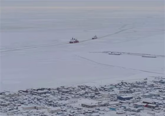 The Coast Guard cutter Healy guides the Russian tanker Renda closer to the fuel transfer mooring point in Nome, Alaska, on Saturday.
